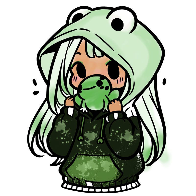 a girl holding a froggy hoodie