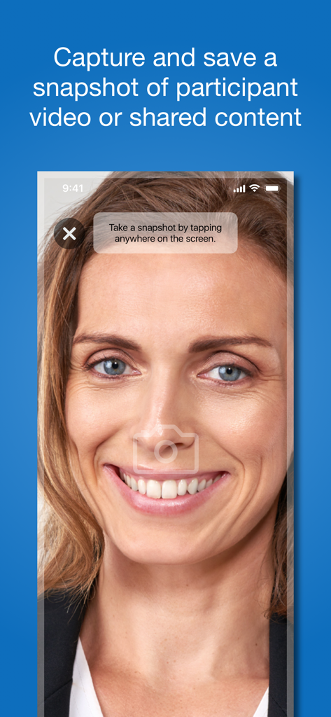 VidyoConnect - A woman's face on a VidyoConnect mobile call with an overlay instructing the user to tap to take a snapshot.
