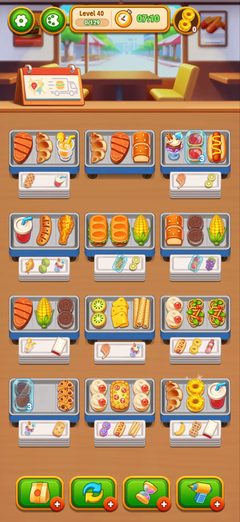 A mobile game screen showing various food items like croissants corn and hot dogs arranged on trays for a sorting puzzle