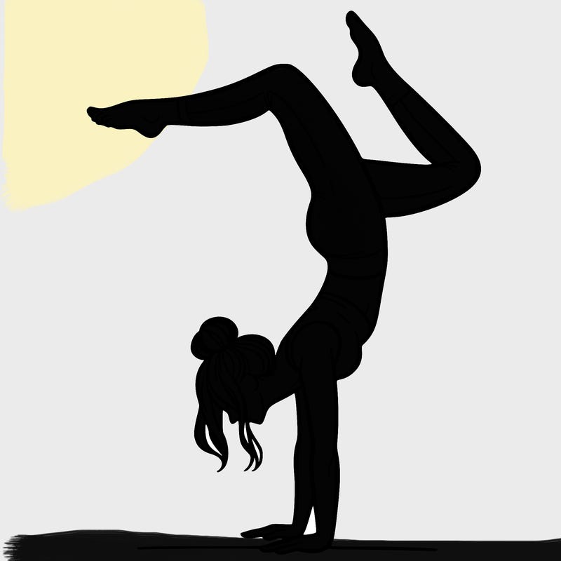 a woman doing a handstand