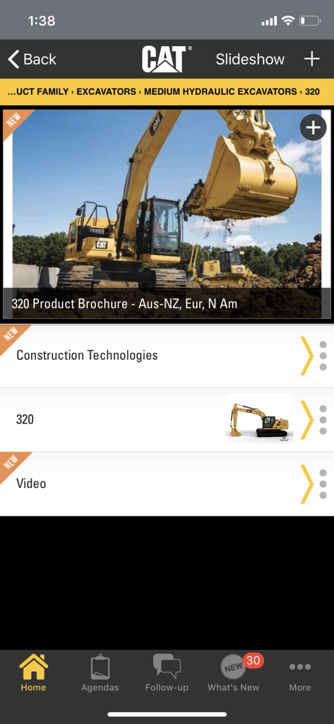 Interface of the Cat Virtual Showroom app showing marketing materials and specifications for the 320 excavator model.