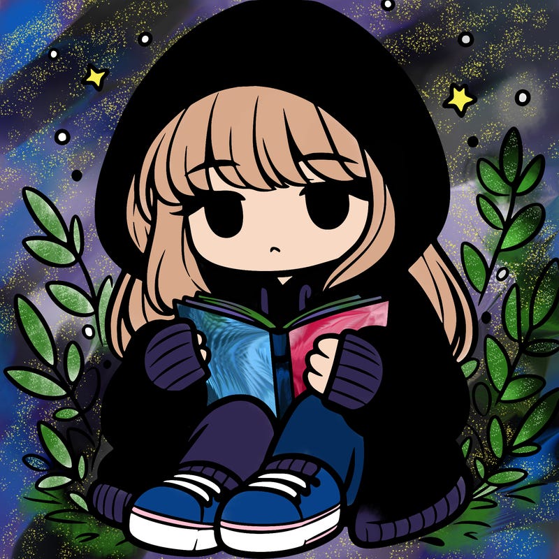 girl in oversized hoodie reading a book