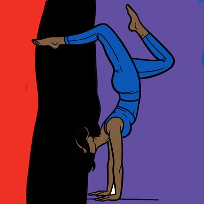 a woman doing a handstand