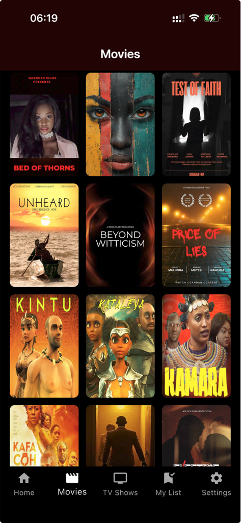 Play It Loud - A screen from the Play It Loud app showing a library of African and Ugandan movie posters under the Movies tab.
