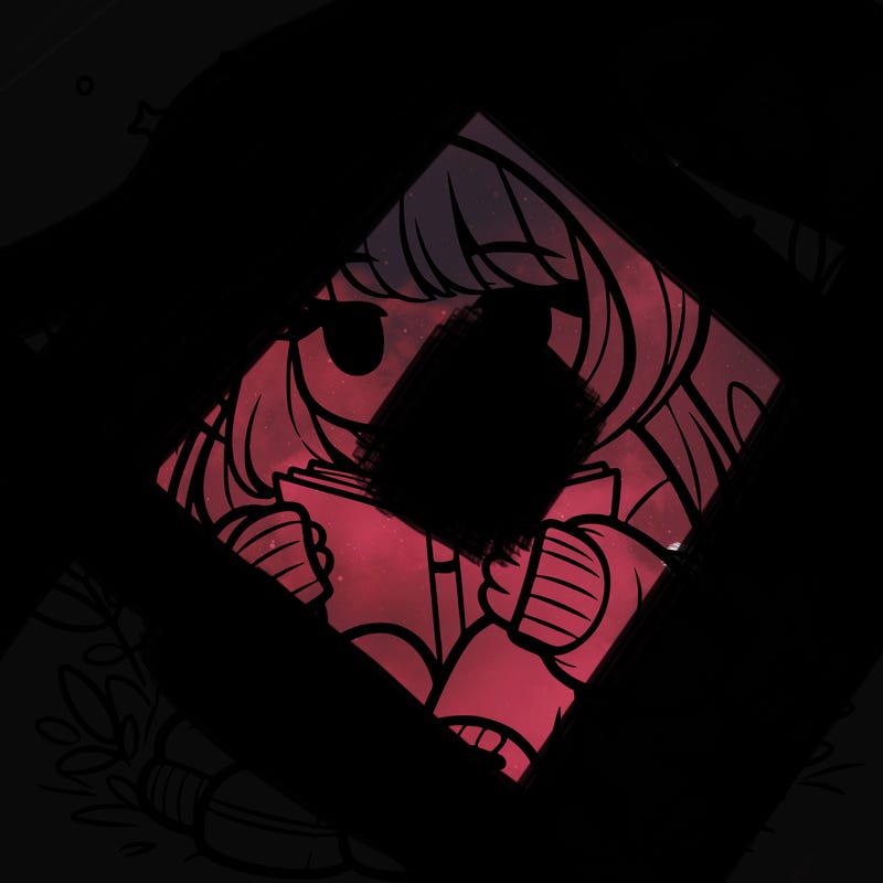 girl in oversized hoodie reading a book