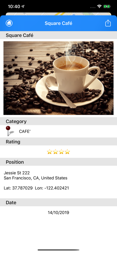 Detailed view of a saved cafe pin in the Pin the World 2 app showing photo rating address and coordinates