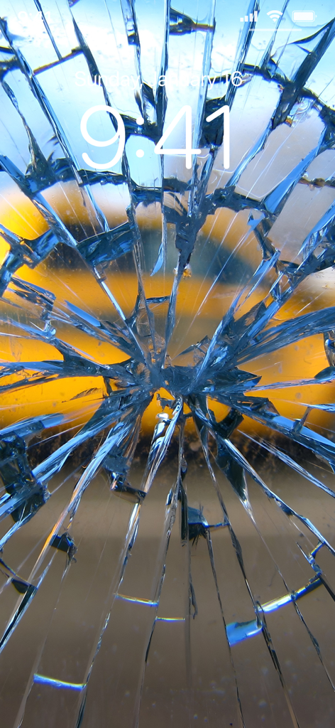 Broken Screen Wallpapers 4K - A hyper realistic shattered glass wallpaper on an iPhone lock screen displaying the time and date