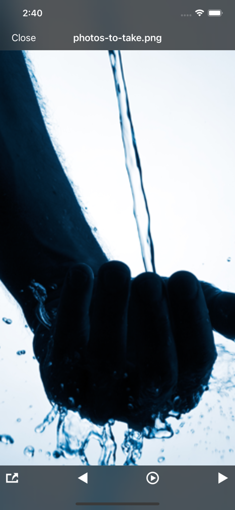 The iFiles app interface displaying a saved image of water flowing into a hand