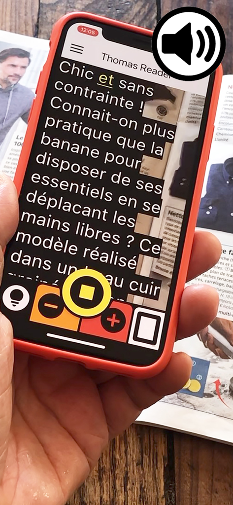 Thomas Reader - Smartphone using Thomas Reader app to scan and display magnified text from a magazine