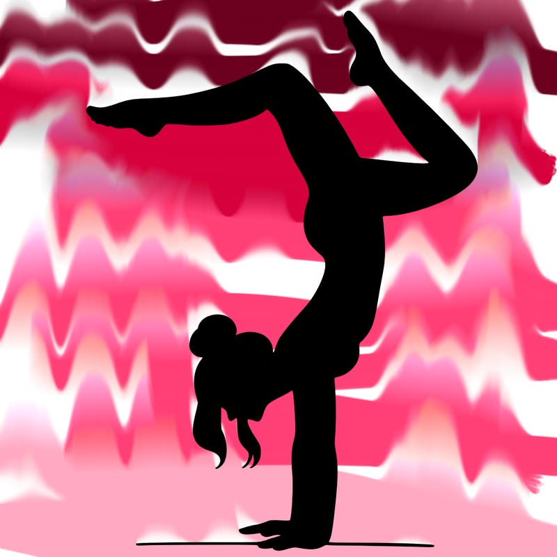 a woman doing a handstand