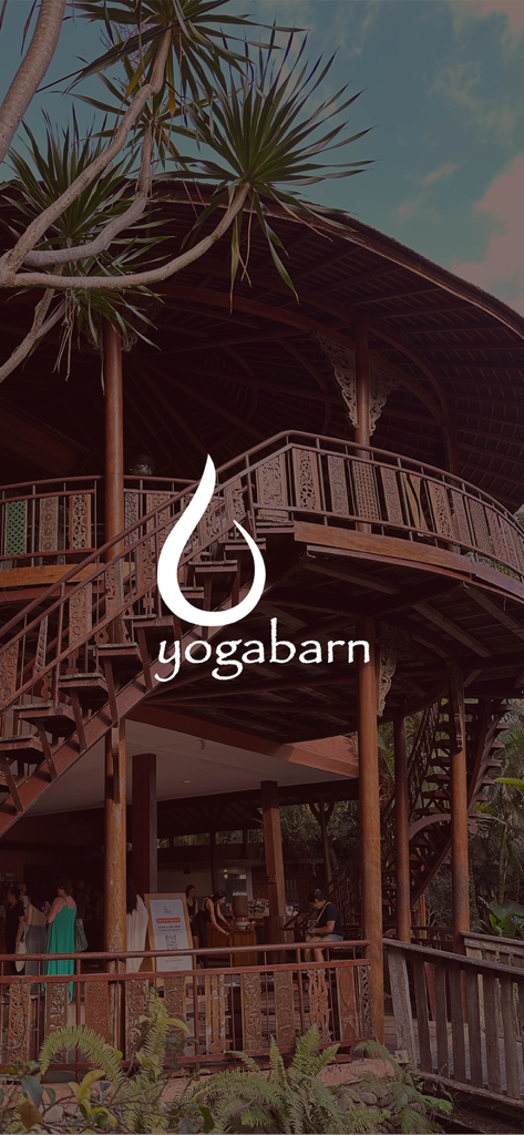 THE YOGA BARN BALI - Traditional wooden yoga studio structure in Bali with the Yoga Barn logo