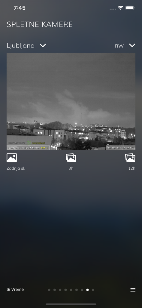 A live webcam image of Ljubljana city at night within the SiVreme weather application.