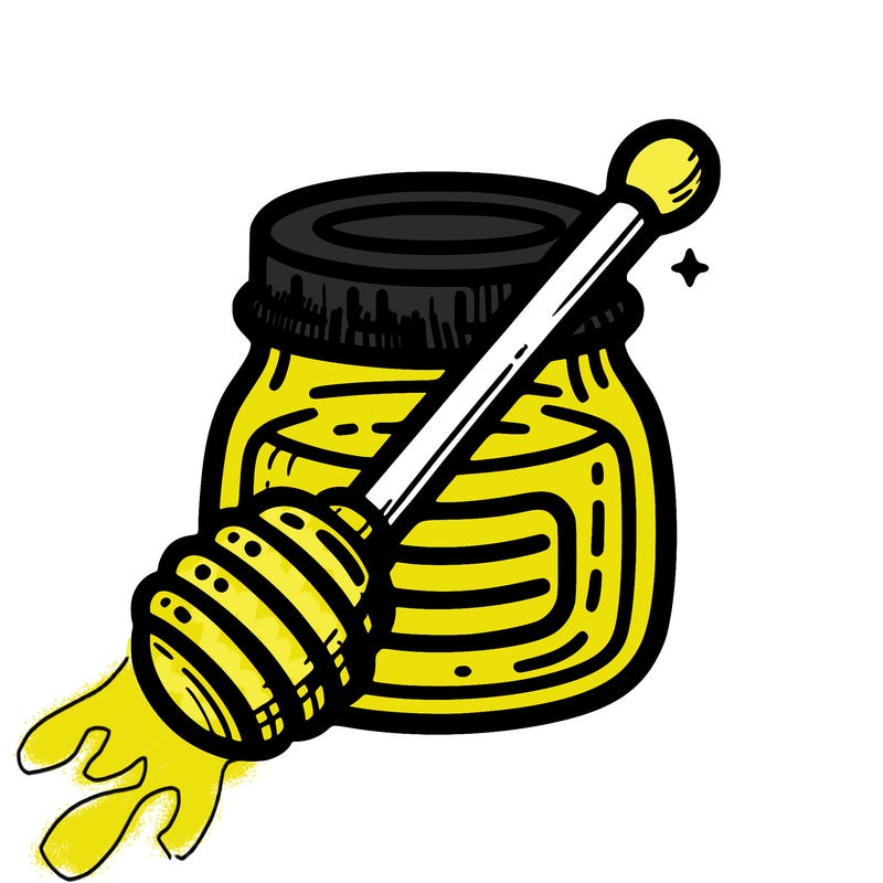 🍯 honey jar – a jar of honey with a wooden dipper.
