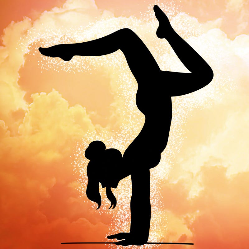 a woman doing a handstand