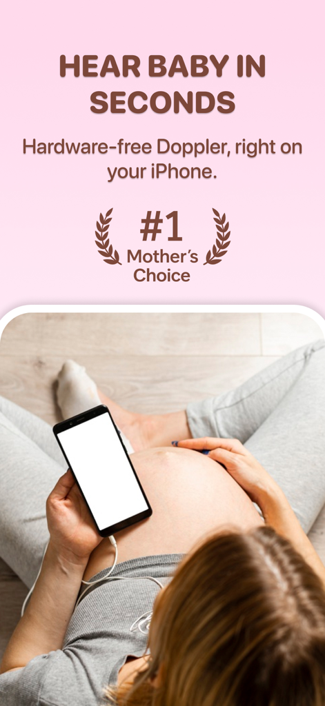 A pregnant woman using her iPhone as a baby heartbeat monitor with the Wombly app