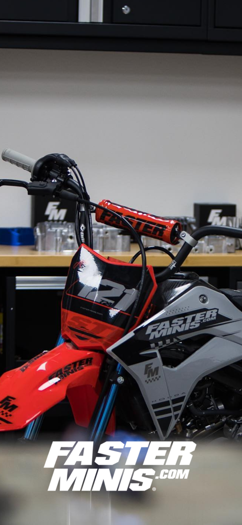Faster-Minis - A custom-built pitbike featuring Faster Minis parts and decals in a garage.