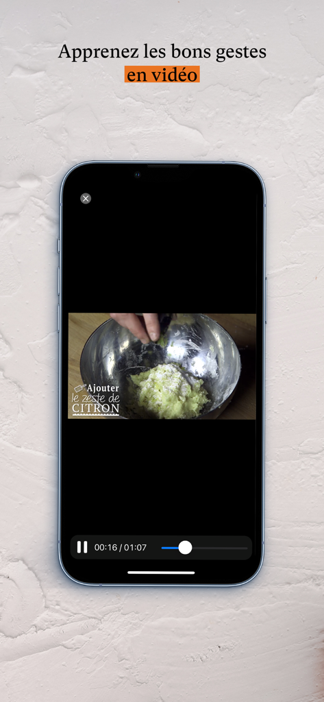 Le Figaro Cuisine - A smartphone showing a video tutorial on French cooking techniques from the Le Figaro Cuisine app
