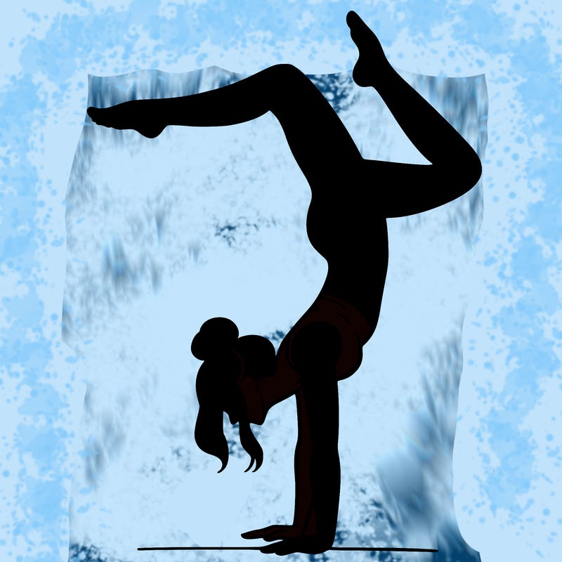 a woman doing a handstand