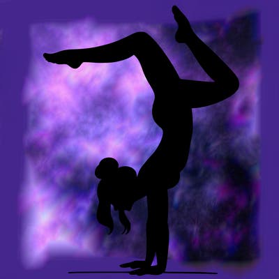 a woman doing a handstand