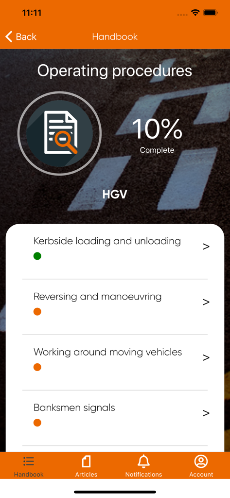 The Driver Handbook app interface showing HGV operating procedures training modules and completion status