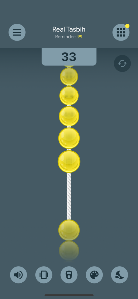 Real Tasbih Counter: Misbaha - Digital tasbih counter app interface with yellow prayer beads and a count of thirty-three