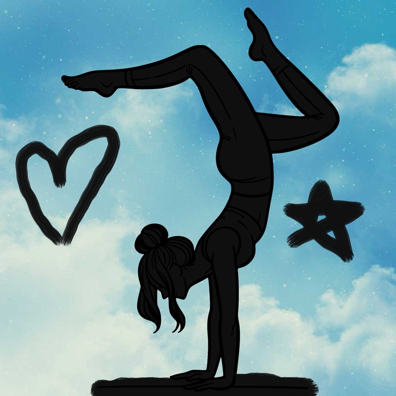 a woman doing a handstand