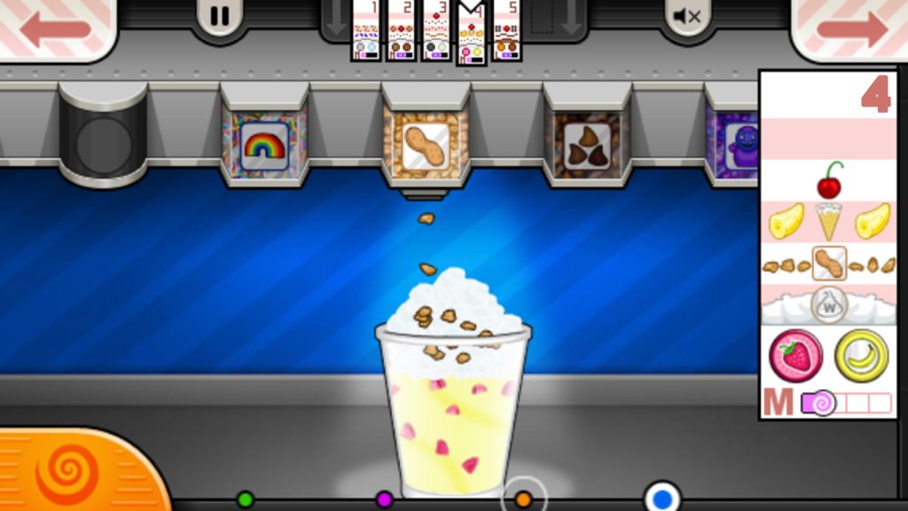 Adicionando coberturas de amendoim a um sundae de sorvete no jogo mobile Papa's Freezeria To Go