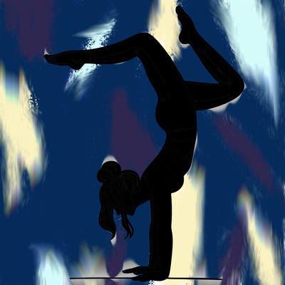 a woman doing a handstand