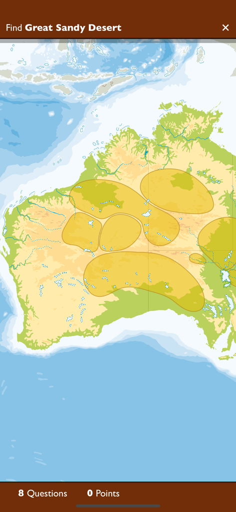 Uma tela de quiz de geografia mostrando um mapa da Austrália com um desafio para encontrar o Grande Deserto de Areia.