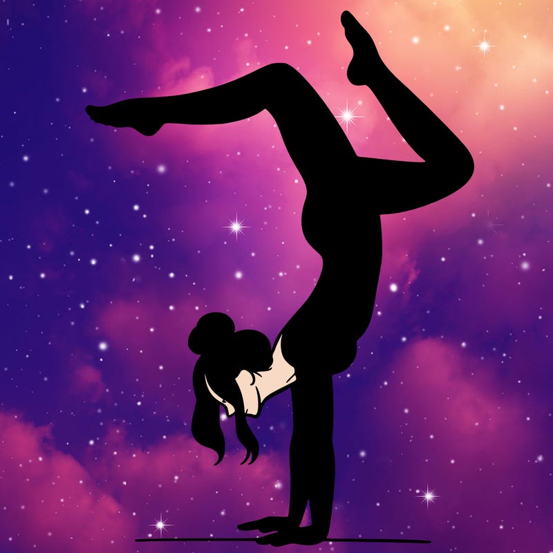 a woman doing a handstand