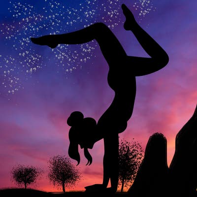 a woman doing a handstand