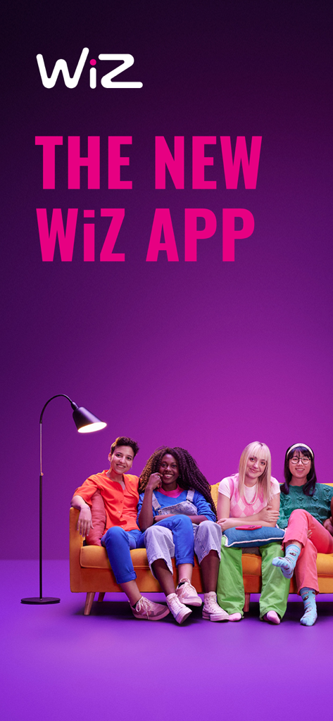 Four young women sitting on a yellow sofa in a room with purple smart lighting and the WiZ app logo