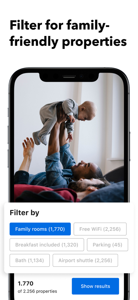 Booking.com app interface showing a family rooms filter with a picture of a man playing with a baby