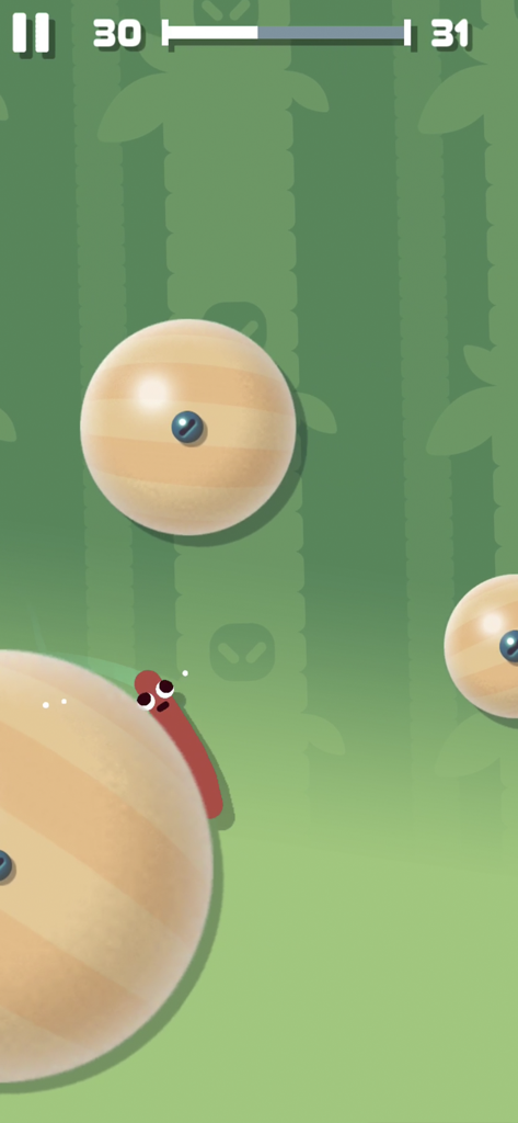 Sausage character sticking to a wooden ball in Sausage Flip mobile game