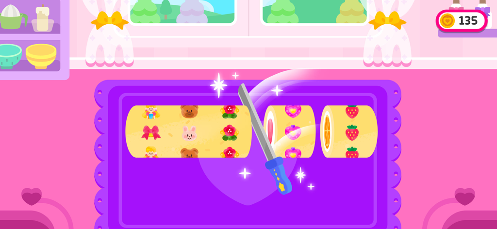 Cocobi Cake Maker - Cortando un rollo de pastel con patrón colorido en el juego de pastelería Cocobi Cake Maker