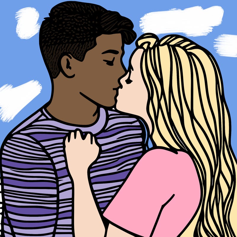 two teenagers kissing