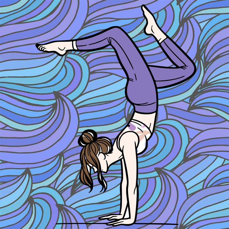 a woman doing a handstand