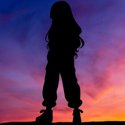 girl in baggy pants crop top and long hair