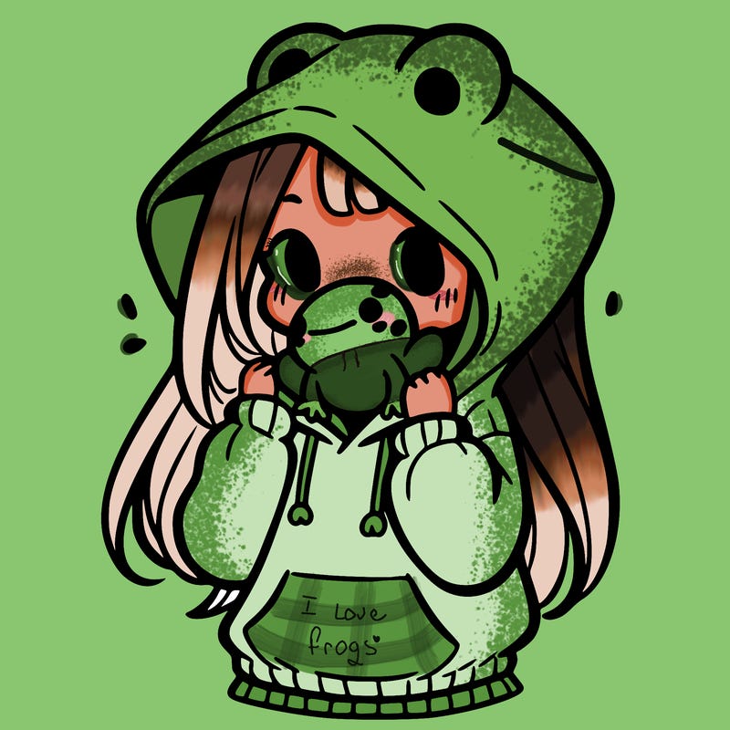 a girl holding a froggy hoodie