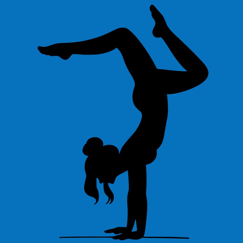 a woman doing a handstand
