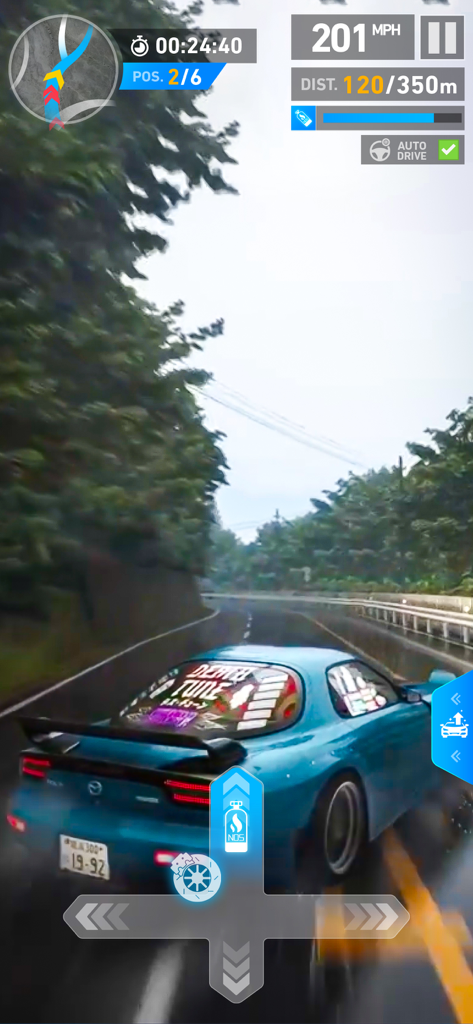 Gameplay of Racing Master Pro showing a blue sports car driving on a wet mountain road at high speed