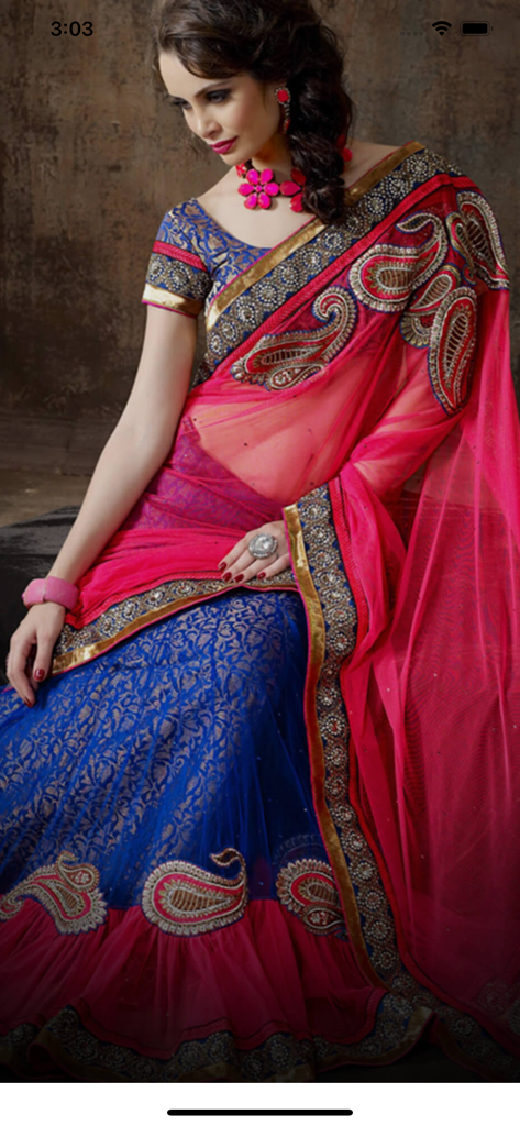 Mirraw Sarees - A woman modeling a designer pink and blue embroidered saree with gold borders from Mirraw