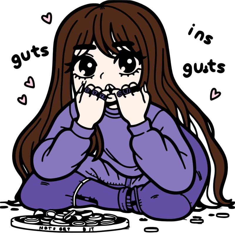 a girl bitting her nails on the floor with long hair and rings that say guts on it