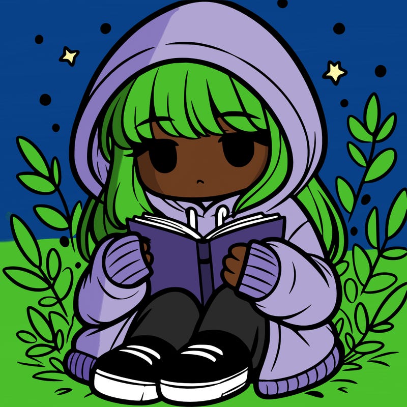 girl in oversized hoodie reading a book