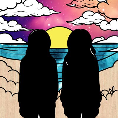 two girls facing backwards staring at the sunset