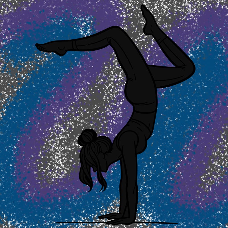 a woman doing a handstand