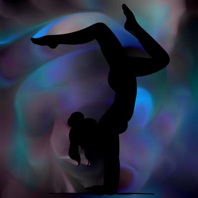 a woman doing a handstand