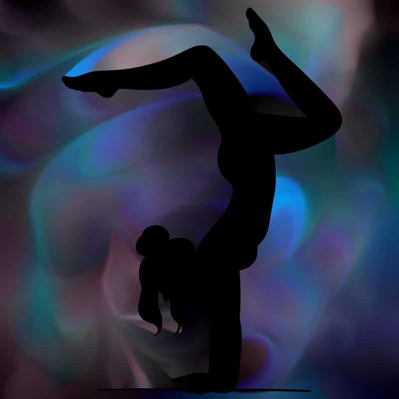 a woman doing a handstand