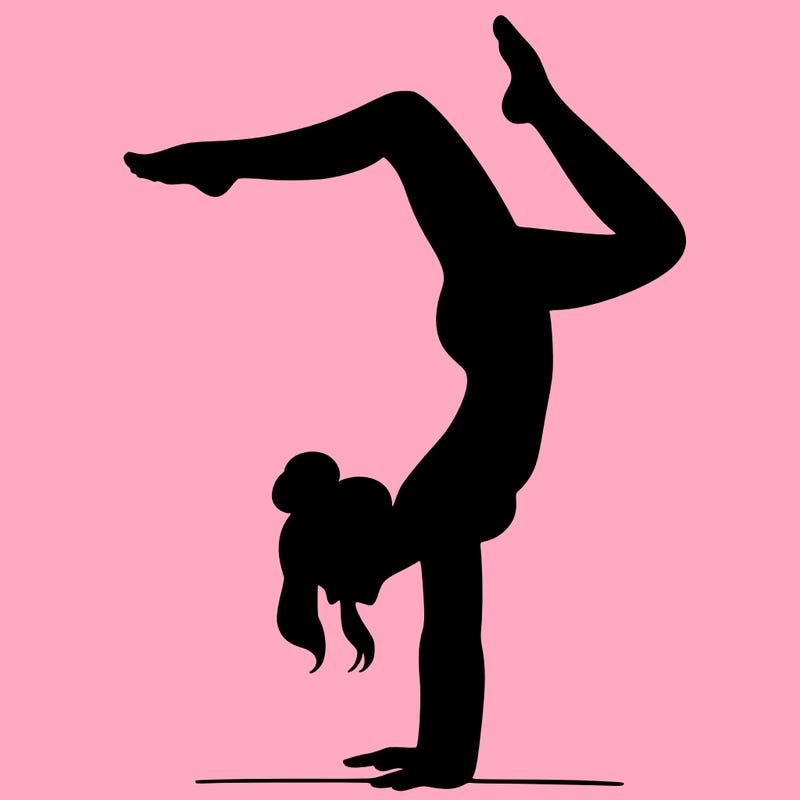 a woman doing a handstand