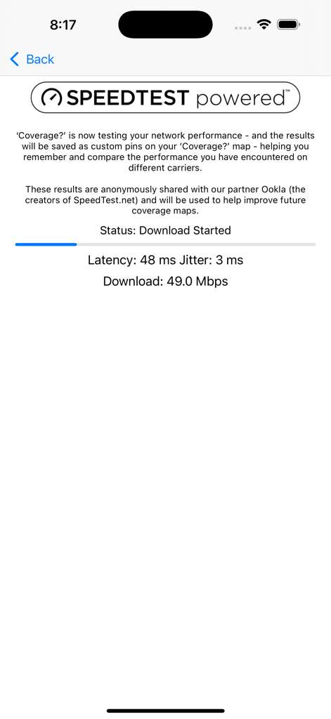 A screen in the Coverage app showing real time network performance results including download speed and latency powered by Ookla